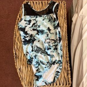 Black, blue, and white plum adult small gymnastics leotard.
